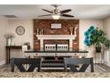 Bright dining area with brick fireplace and built-in seating at 17242 N 29Th Dr, Phoenix, AZ 85053