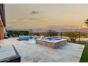 Resort-style backyard oasis featuring a pool, spa, and patio at 26686 W Piute Ave, Buckeye, AZ 85396