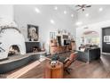 Bright living room featuring high ceilings, a charming fireplace, and stylish furniture at 2904 N Platina --, Mesa, AZ 85215