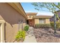 Inviting single-story home entrance with desert landscaping at 41532 N Clear Crossing Rd, Anthem, AZ 85086