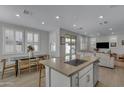 Modern kitchen with island, stainless steel appliances, and light cabinets at 4845 S Ferric --, Mesa, AZ 85212