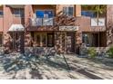 Close up of the facade of townhomes, showing multiple entrances and balcony at 6605 N 93Rd Ave # 1101, Glendale, AZ 85305