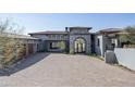 Stunning home exterior with red brick circular driveway and tile roof at 6825 N 39Th Pl, Paradise Valley, AZ 85253
