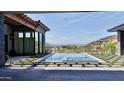 Backyard with a modern tiled pool, stepping stones and mountain views beyond the backyard fence at 6825 N 39Th Pl, Paradise Valley, AZ 85253
