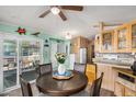 Dining area with round table and chairs, adjacent to kitchen at 8700 E University Dr # 737, Mesa, AZ 85207