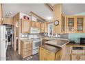 Bright kitchen with ample wood cabinets and appliances at 8700 E University Dr # 737, Mesa, AZ 85207