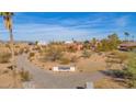 Ranch home with a large yard and a long driveway at 888 W Vah Ki Inn Rd, Coolidge, AZ 85128