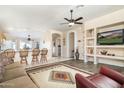 Open floor plan connecting living room and kitchen with hardwood floors at 8957 E Rainier Dr, Gold Canyon, AZ 85118