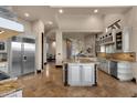 Bright, modern kitchen featuring granite countertops, stainless steel appliances, and custom cabinetry at 9815 N Copper Ridge Trl, Fountain Hills, AZ 85268