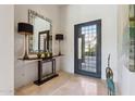 Bright entryway with a modern console table and large mirror at 10585 E Crescent Moon Dr # 33, Scottsdale, AZ 85262