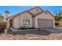 Tan colored house with a two-car garage and walkway at 1085 W Dava Dr, Tempe, AZ 85283