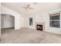 Spacious living room featuring a fireplace and carpet flooring at 1085 W Dava Dr, Tempe, AZ 85283