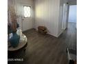 Cozy living room features wood-look floors and neutral wall color at 11411 N 91St Ave # 170, Peoria, AZ 85345