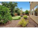 Backyard with putting green, fountain and patio at 1188 W Laredo Ave, Gilbert, AZ 85233