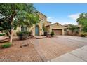 Two-story house with a brick driveway and landscaping at 1188 W Laredo Ave, Gilbert, AZ 85233