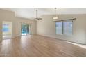 Open living room with tile floors and access to backyard at 1207 W Sea Bass Ct, Gilbert, AZ 85233