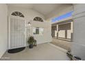 Front entry with a security door and decorative planters at 15034 N 30Th St, Phoenix, AZ 85032