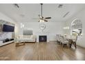 Living room features hardwood floors, fireplace, and dining area at 15034 N 30Th St, Phoenix, AZ 85032