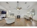 Living room features hardwood floors, fireplace, and sitting area at 15034 N 30Th St, Phoenix, AZ 85032