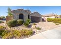 Charming single-story home with well-maintained desert landscaping and a brick driveway at 15804 N 109Th Dr, Sun City, AZ 85351