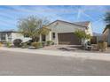 Single-story home with a two-car garage and desert landscaping at 16247 S 180Th Dr, Goodyear, AZ 85338