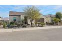 Single-story home with a two-car garage and desert landscaping at 16247 S 180Th Dr, Goodyear, AZ 85338