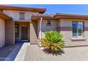 Front entry with walkway and mature desert landscaping at 20876 N Canyon Whisper Dr, Surprise, AZ 85387