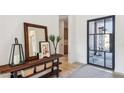 Bright and airy entryway with a console table and a view to the backyard at 23491 N 125Th Pl, Scottsdale, AZ 85255