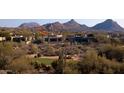 Single story home with mountain views and a golf course at 28492 N 95Th Pl, Scottsdale, AZ 85262