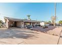 House exterior with solar panels and spacious driveway at 410 N 56Th Pl, Mesa, AZ 85205