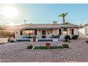 Ranch style home with carport and manicured lawn at 410 N 56Th Pl, Mesa, AZ 85205