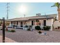 Charming single-story home with a well-kept front yard and appealing landscaping at 410 N 56Th Pl, Mesa, AZ 85205