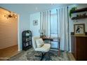 Comfortable home office area with neutral tones, stylish desk, accent wall, and natural light at 4354 N 82Nd St # 137, Scottsdale, AZ 85251