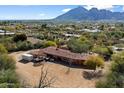 Aerial view of single-story home with mountain views at 4510 E Pepper Tree Ln, Paradise Valley, AZ 85253