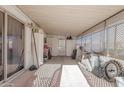 Enclosed back patio with storage and laundry area at 5807 E Leonora St, Mesa, AZ 85215