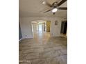 View of the living room, kitchen, and backyard access at 6039 N 73Rd Ave, Glendale, AZ 85303