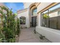 Stunning front entrance with a modern glass door and manicured landscaping at 7705 E Doubletree Ranch Rd # 56, Scottsdale, AZ 85258