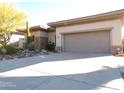 Single-story home with desert landscaping and two-car garage at 7741 E Balao Dr, Scottsdale, AZ 85266