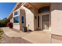 Front entrance with security door and walkway at 7928 E Pueblo Ave # 62, Mesa, AZ 85208