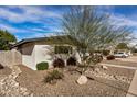 Recently updated home with a landscaped yard and rock accents at 8620 E Starlight Way, Scottsdale, AZ 85250