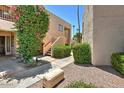 Landscaped walkway leading to condo building entrance at 9275 E Mission Ln # 207, Scottsdale, AZ 85258