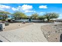 Luxury home with stone walkway and desert landscaping at 12129 N 114Th Way, Scottsdale, AZ 85259