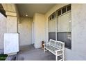 Front porch with white bench and large window at 19520 N 65Th Ave, Glendale, AZ 85308
