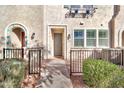 Townhome entry with gray door and small front yard at 1959 E Hampton Ln # 102, Gilbert, AZ 85295