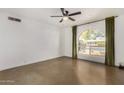 Bright bedroom with large window and ceiling fan at 321 W Palo Verde St, Gilbert, AZ 85233