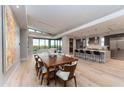 Spacious open-plan kitchen and dining area with an island and outside views at 37200 N Cave Creek Rd # 2127, Scottsdale, AZ 85262