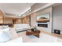 Comfortable living room with a fireplace, TV, and modern decor at 37200 N Cave Creek Rd # 2127, Scottsdale, AZ 85262