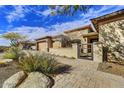 Modern home with inviting walkway and lush landscaping at 6010 E Brianna Rd, Cave Creek, AZ 85331