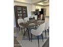 Dining area with table set for four and a china cabinet at 6480 N 82Nd St # 1111, Scottsdale, AZ 85250