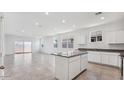 Bright kitchen with granite counters, stainless appliances and views to an open living area at 8470 W Mantle Way, Florence, AZ 85132